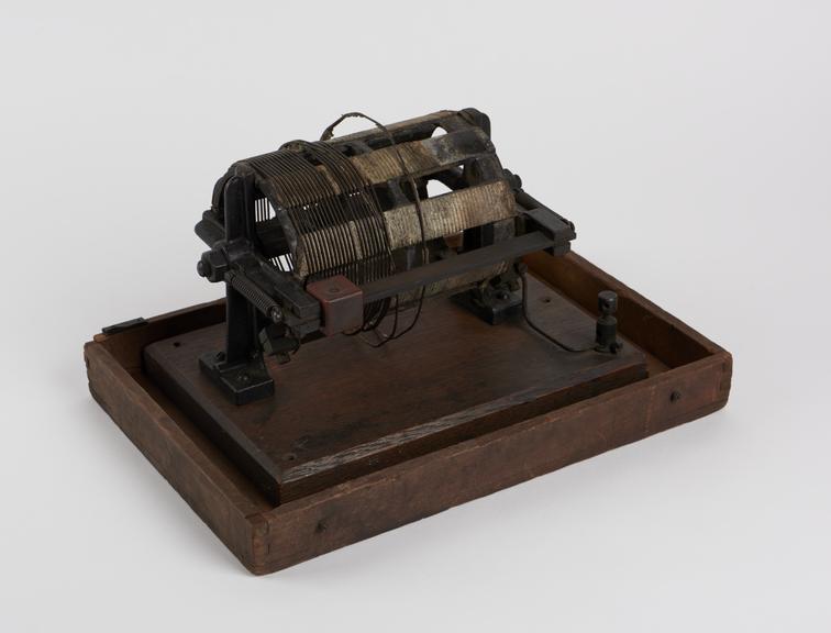 Sliding rheostat on rectangular wooden base set inside wooden