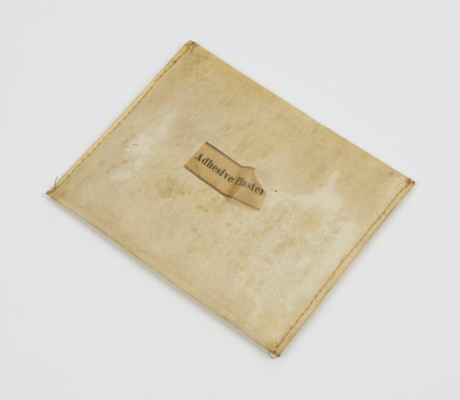 Waxed paper envelope containing adhesive plaster