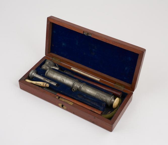 Enema syringe and accessories, cased, by Evans and Co., English