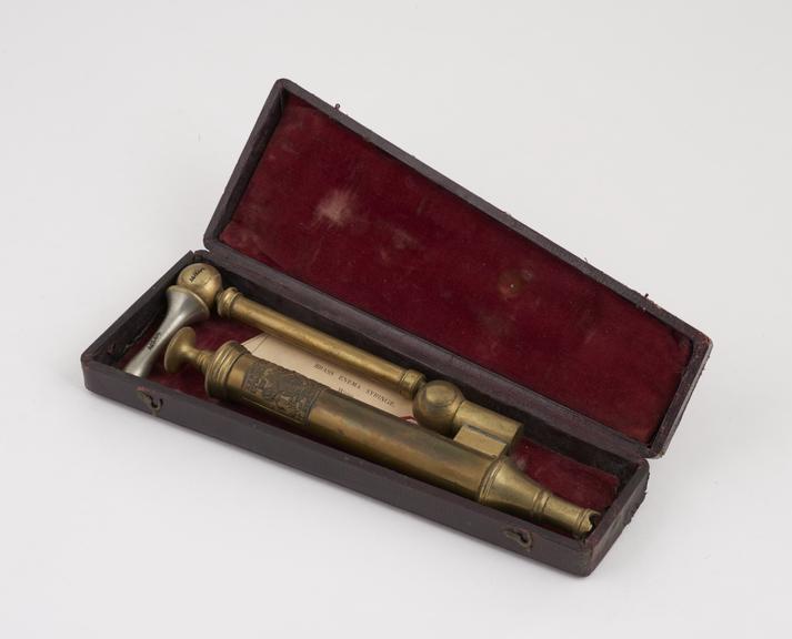 Brass enema syringe, piston-action, fold into case