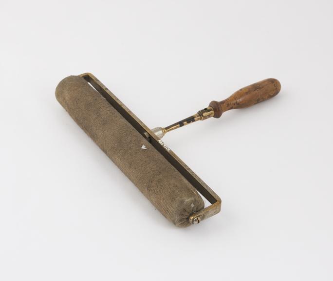 Cloth covered electrical roller with brass and wooden handle