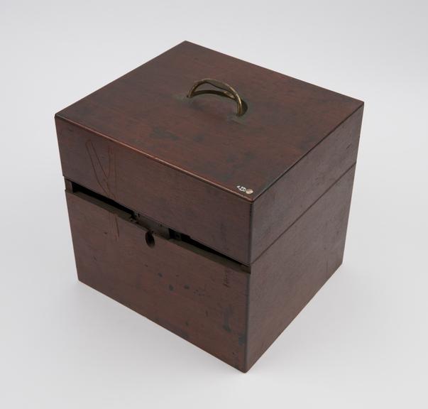 Mahogany medicine chest with sunk brass half-hoop handle on lid