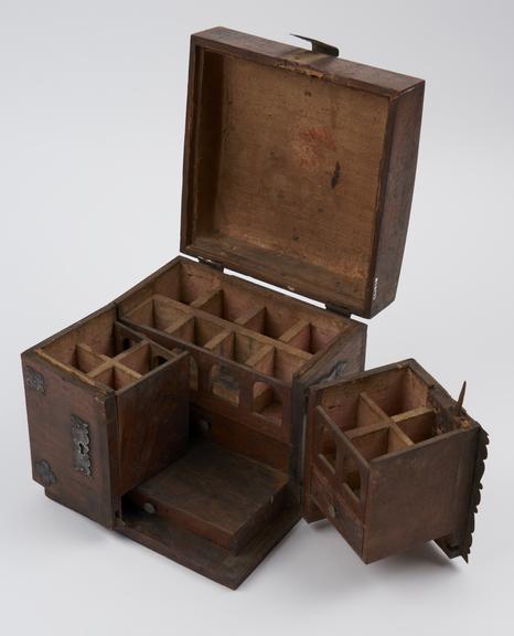 Rectangular wooden medicine chest in 3 hinged sections