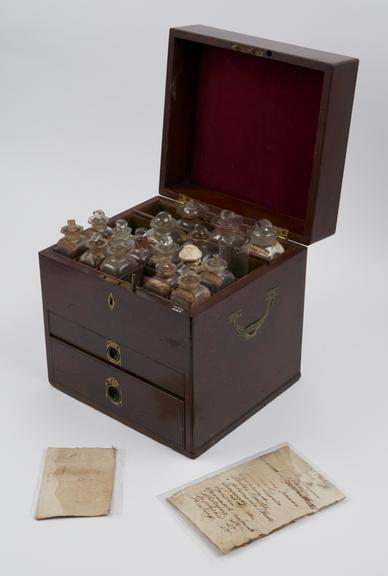 Medicine chest, mahogany, with 26 glass bottles, 22 labelled