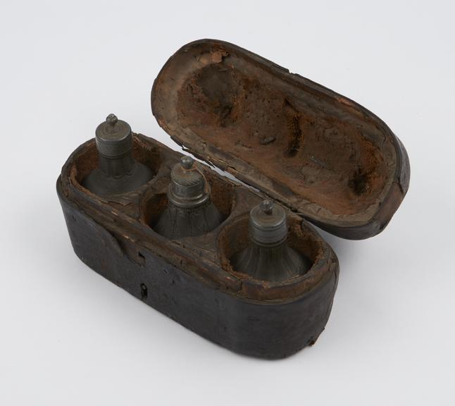 Leather medicine chest with 3 pewter bottles