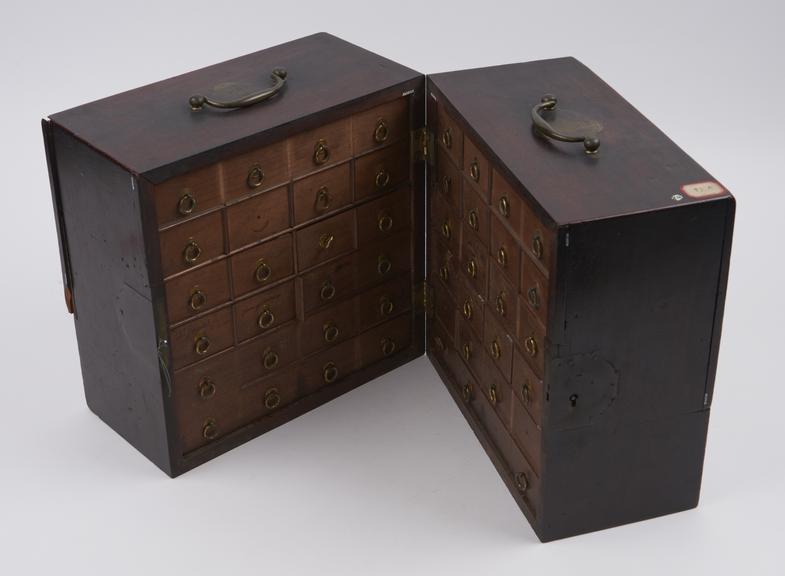 Medicine chest, book-style opening, with 24 glass bottles