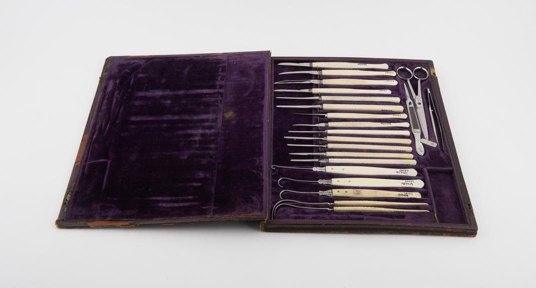 Set of surgical instruments in case shaped like book