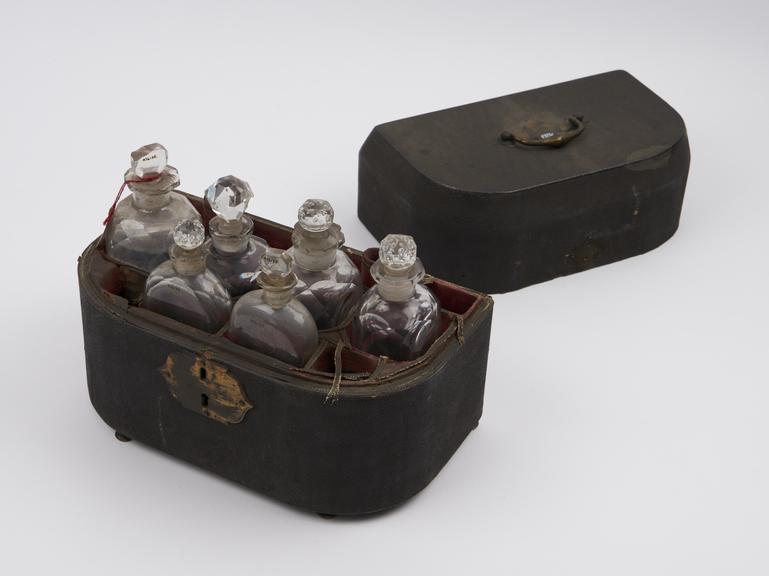 Leather covered medicine chest, rounded front, flat back