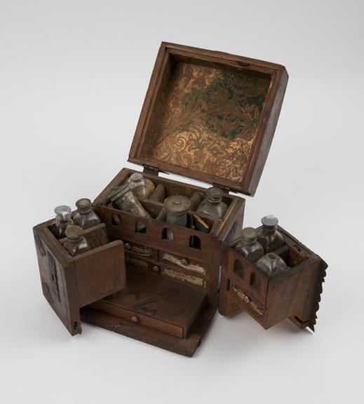 Small ironbound mahogany(?) medicine chest with 2 hinged wing