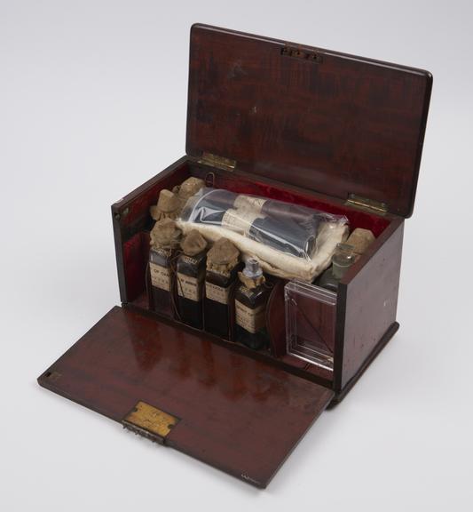 Medicine chest, mahogany, hinged lid and drop front