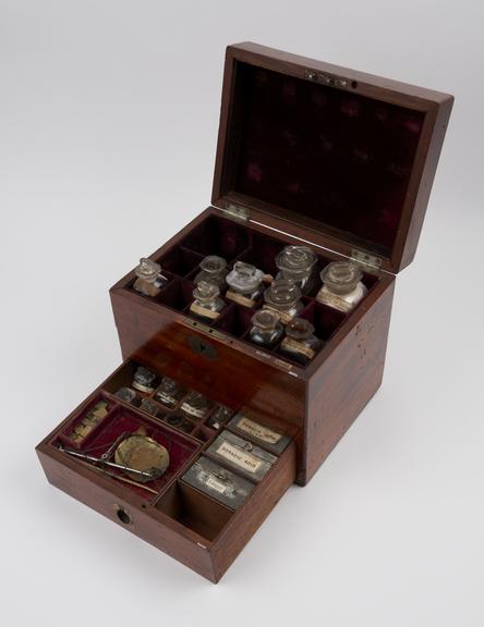 Medicine chest, mahogany, with 17 glass bottles, 15 labelled