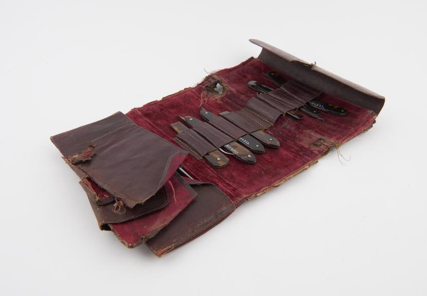 Pocket surgical instrument set in leather wallet