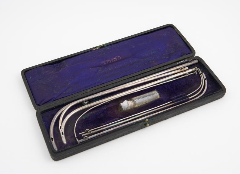 Cased set of 7 catheters, silver(?) by Ramsden Son and Co