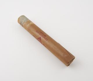 Cylindrical stick of explosive substitute in brown paper wrapper with red printing, printed: ‘POLAR’; ‘N.S. GELIGNITE'