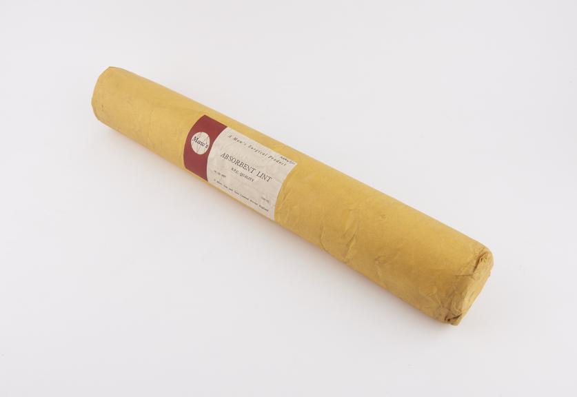 Roll of absorbent lint in yellow paper packet by S