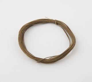 Coil of cotton covered electric wire used in connecting electric detonator circuit in mining