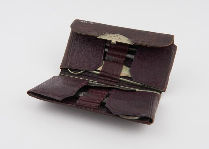 Pocket surgical instrument set in leather wallet