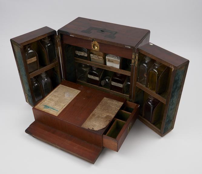 Medicine chest, tryptich drop front