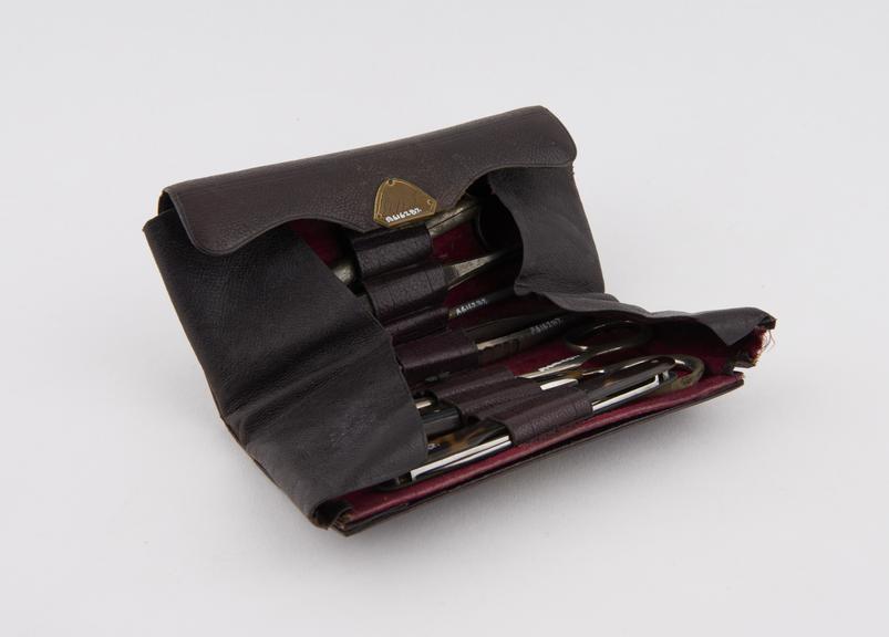 Surgical instrument set in leather wallet