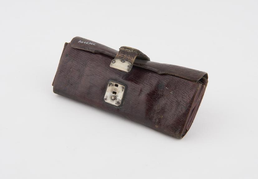 Pocket surgical instrument set in leather wallet