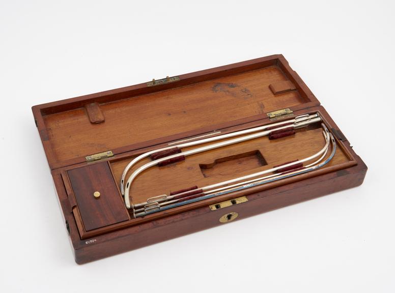 Set of 10 silver-plated lithotomy catheters in mahogany case