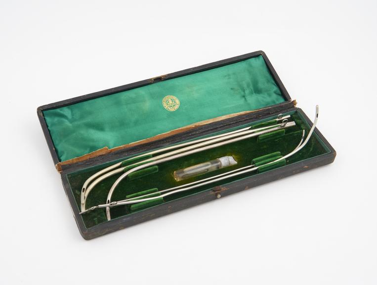 Cased set of catheters, silver and plated(?)