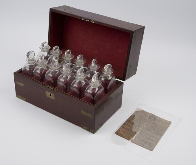 Brass bound medicine chest, containing 12 empty