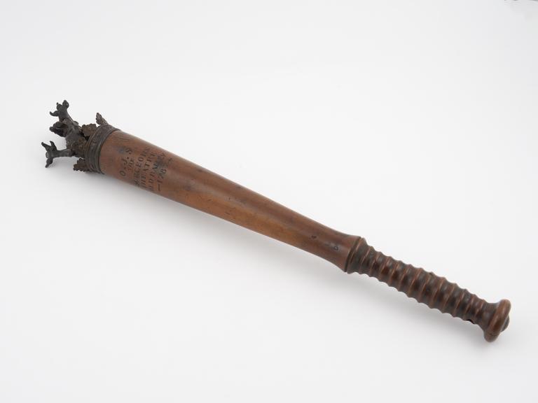 Turned wooden staff surmounted  by metal crown and lion's head