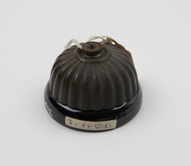 Fuse, black china with ribbed dome-shaped cover