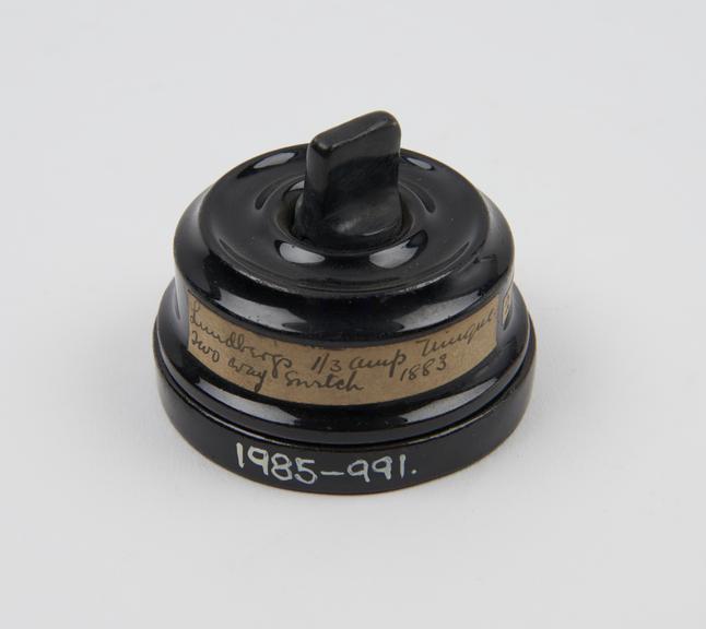 Two-way turn switch, black porcelain, by Lundberg, 1883