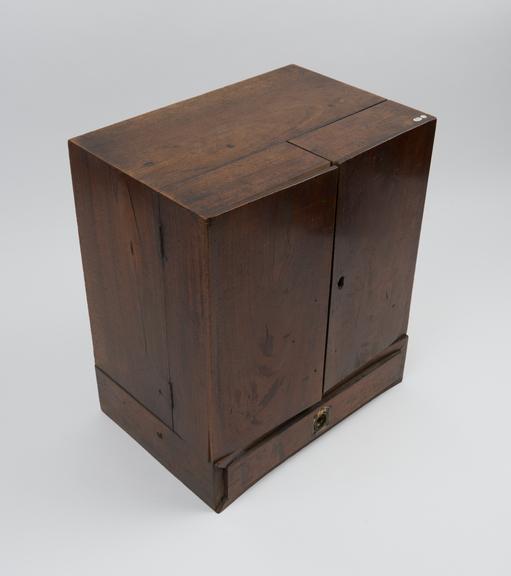 Medicine chest, wooden, with tryptich drop front