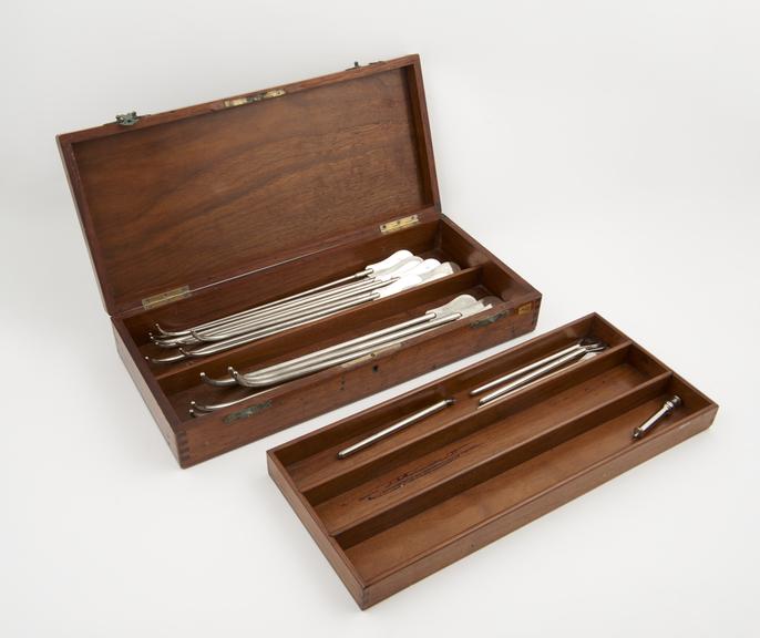 Set of urethral sounds, plated metal, in walnut case