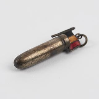 Amulet in the form of a bullet