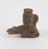 Solid terracotta figure of squatting male with urine jar