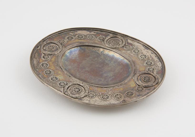 Silver dish, oval, with decorated border which includes 4