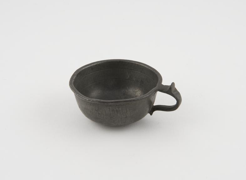 Graduated pewter cup, shallow, with loop handle