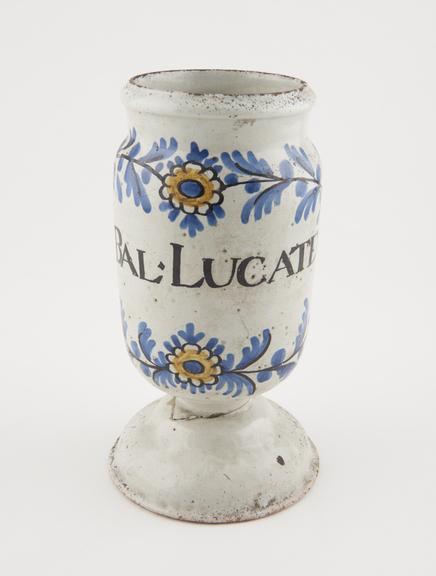 Tin glazed earthenware drug jar, used for Locatelli's balm