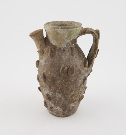 Jug, probably mediaeval Italian, with thin green glaze