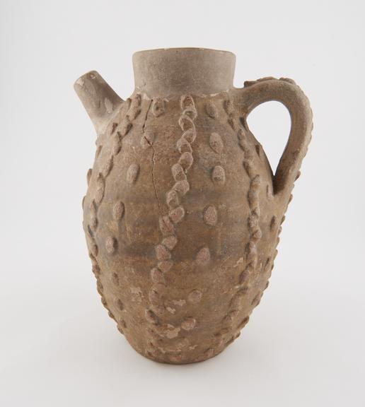 Jug, probably mediaeval Italian, with thin brown glaze