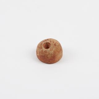 Pierced orange hemispherical earplug
