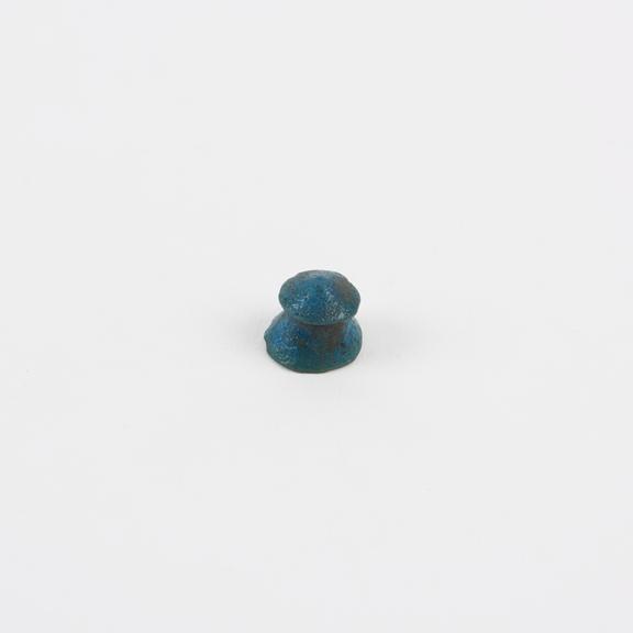 Turquoise earplug, cone with larger angle cone astride vertex