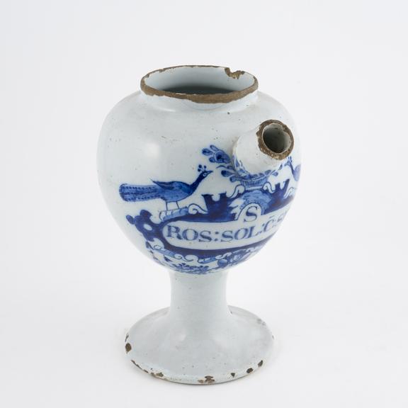 Tin glazed earthenware syrup jar, peacock motif