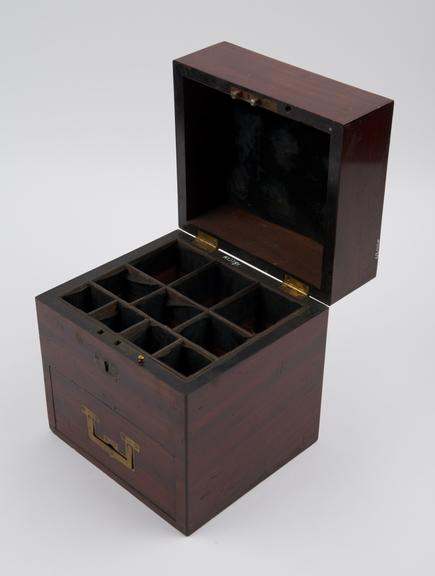 Rectangular wooden medicine chest with hinged lid and front