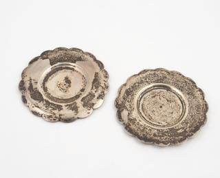 Two silver circumcision disks