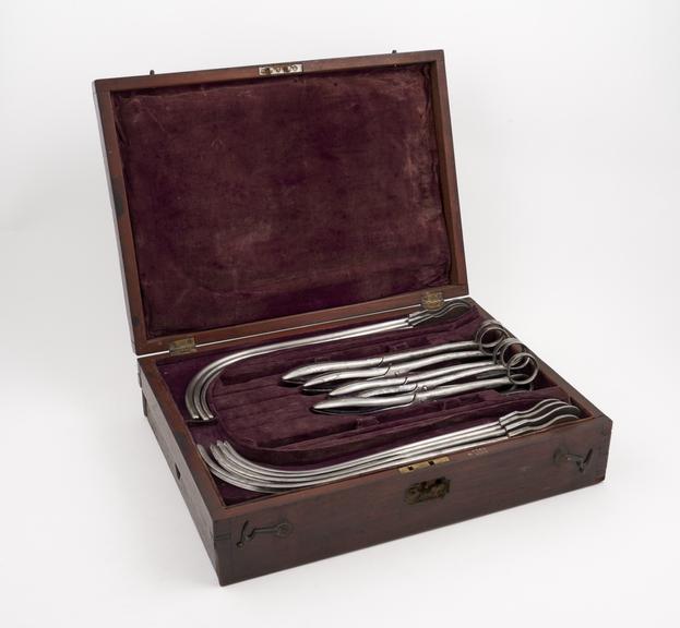 Lithotomy set, incomplete, steel instruments in mahogany case