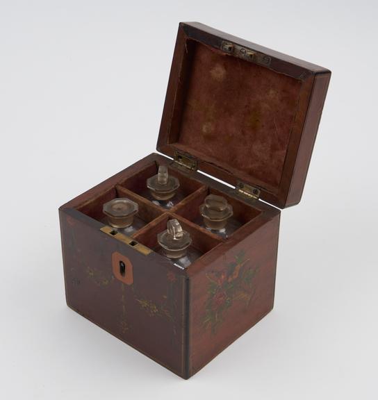 Medicine chest, mohogany, with four labelled glass bottles