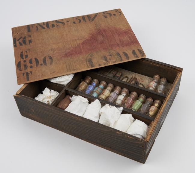 Rectangular wooden box with sliding lid containing 6 jars. 12 bottles of crystals and powders