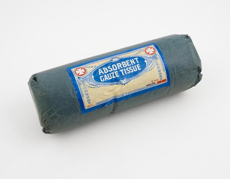 Roll of absorbent gauze tissue in blue paper packet