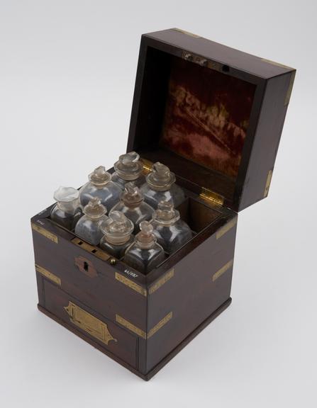 Brass bound mahogany medicine chest with 9 glass bottles