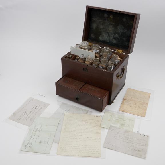 Medicine chest, mahogany, with 18 glass bottles, 17 labelled